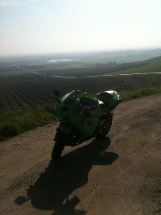 Dustin's second motorcycle, a lime green 2009 Ninja ZX-10R, overlooking the hills of Strathmore California. He rode a similar vehicle during his first motorcycle accidents.