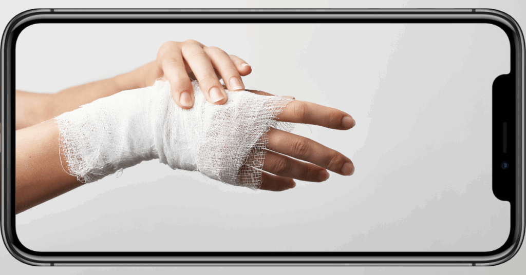 Photo of a smartphone taking a picture of a hand injury wrapped in a bandage